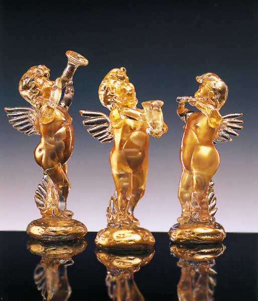 Crystal and gold angel with a trumpet