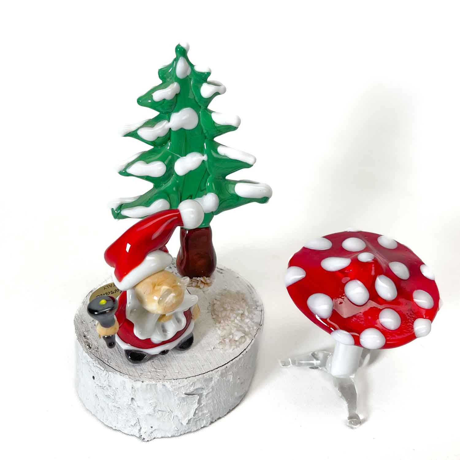 Gnome on wooden base with red mushroom